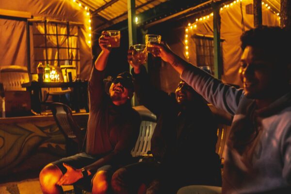 Friends raising glasses together in a cheers