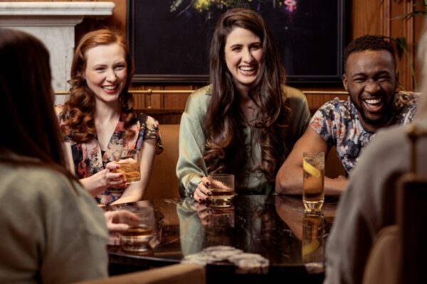 Friends sharing drinks around a table