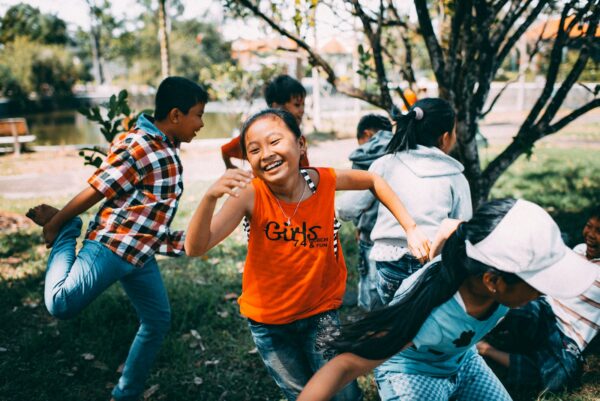 A girl running and laughing